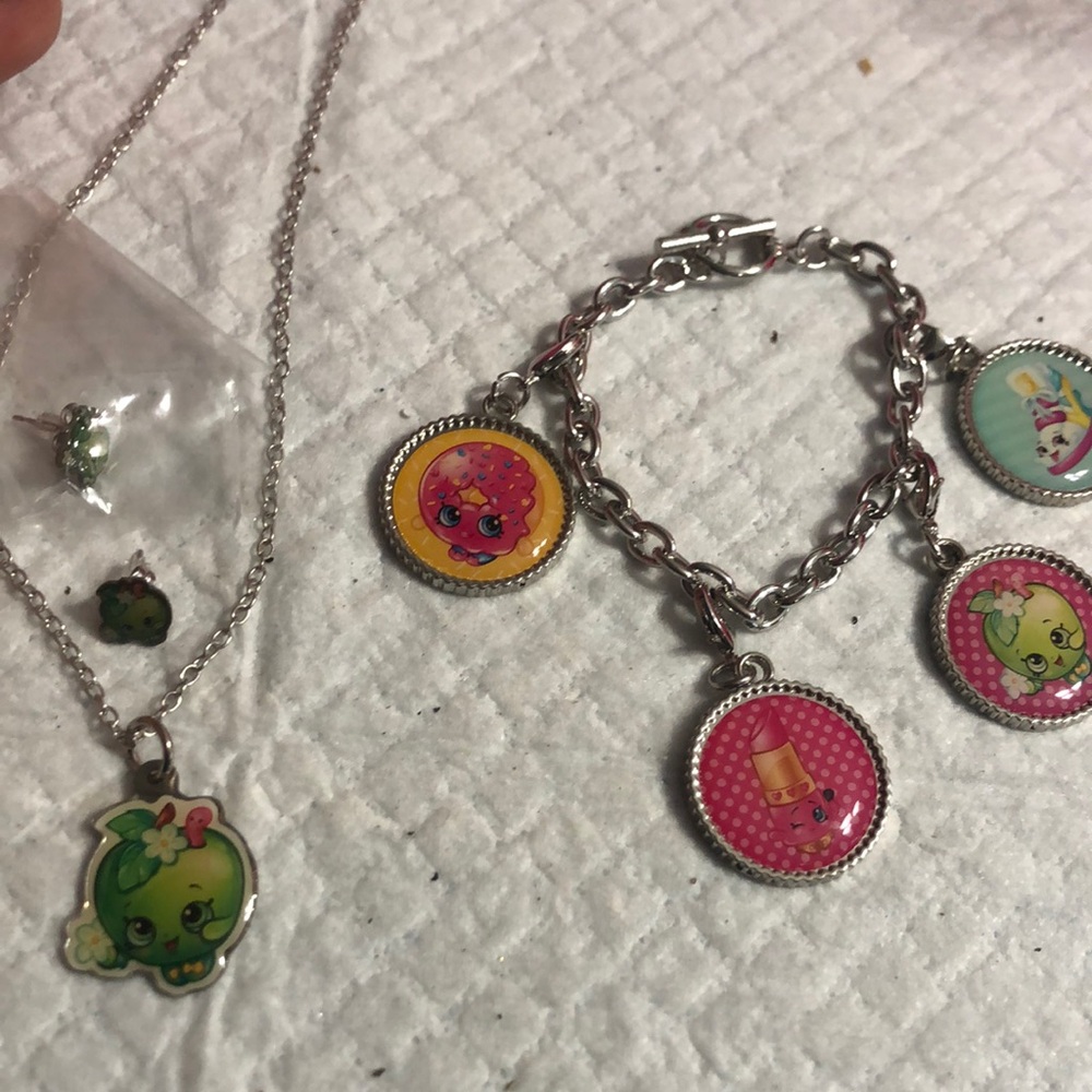 Vibrant Red and Yellow Jewelry Set with Playful Charms